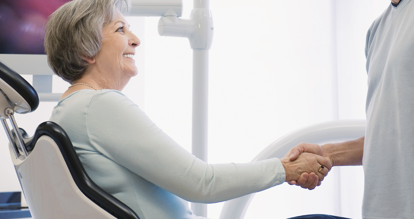Handshake with patient